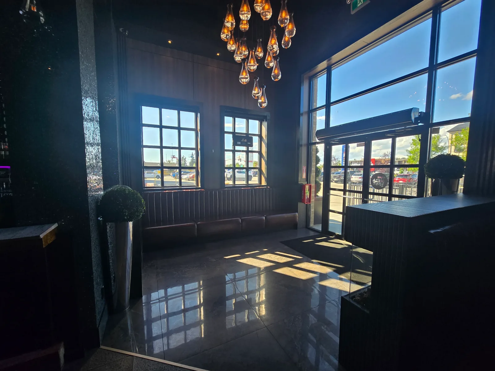 Sunlit entrance and waiting lounge at THE PIZZA SPOT WEM Edmonton, 8882 170 St NW near West Edmonton Mall